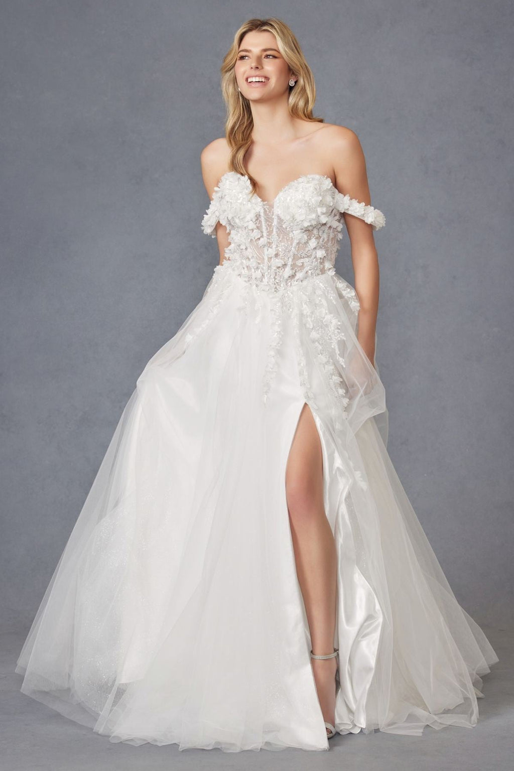 Off-shoulder off-white ball gown with textured floral lace bodice and tulle skirt, front slit