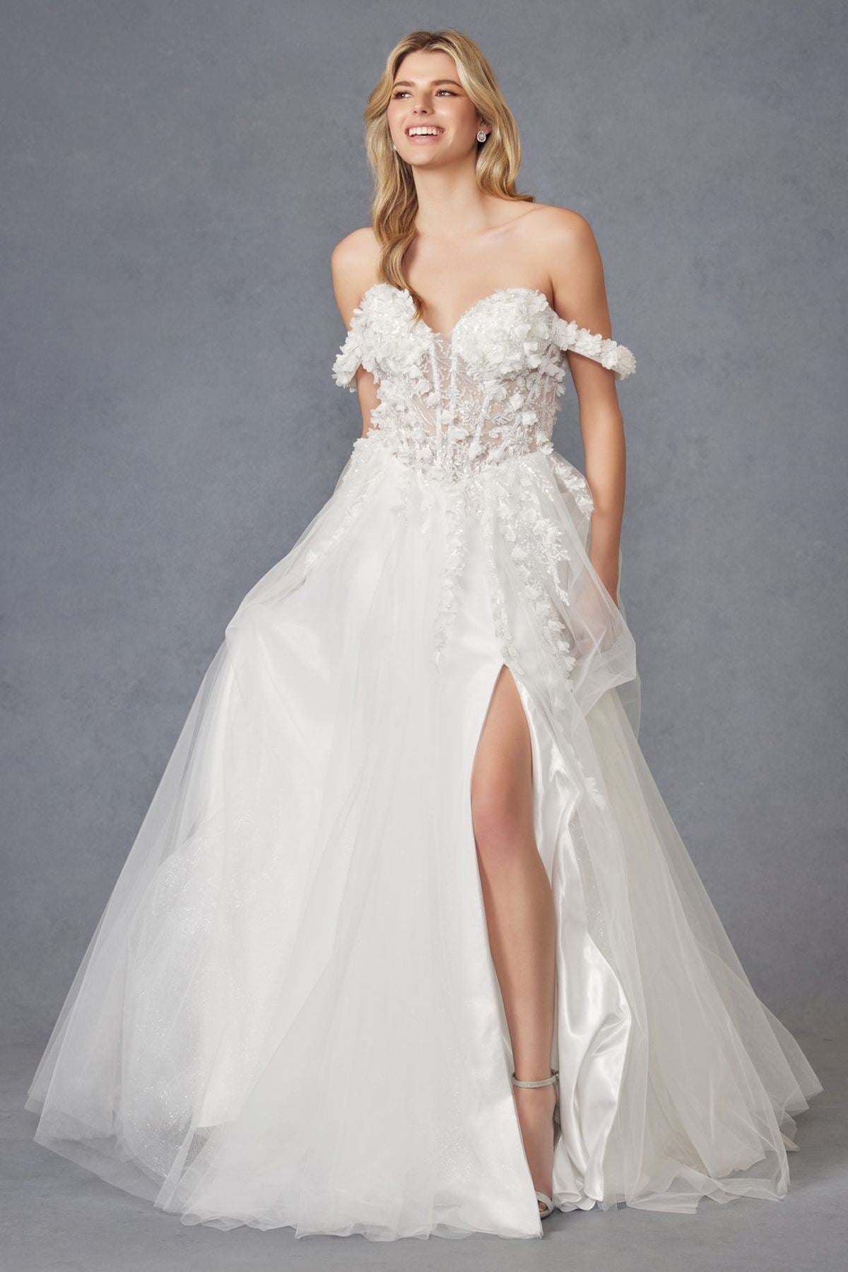 Off-shoulder off-white ball gown with textured floral lace bodice and tulle skirt, front slit
