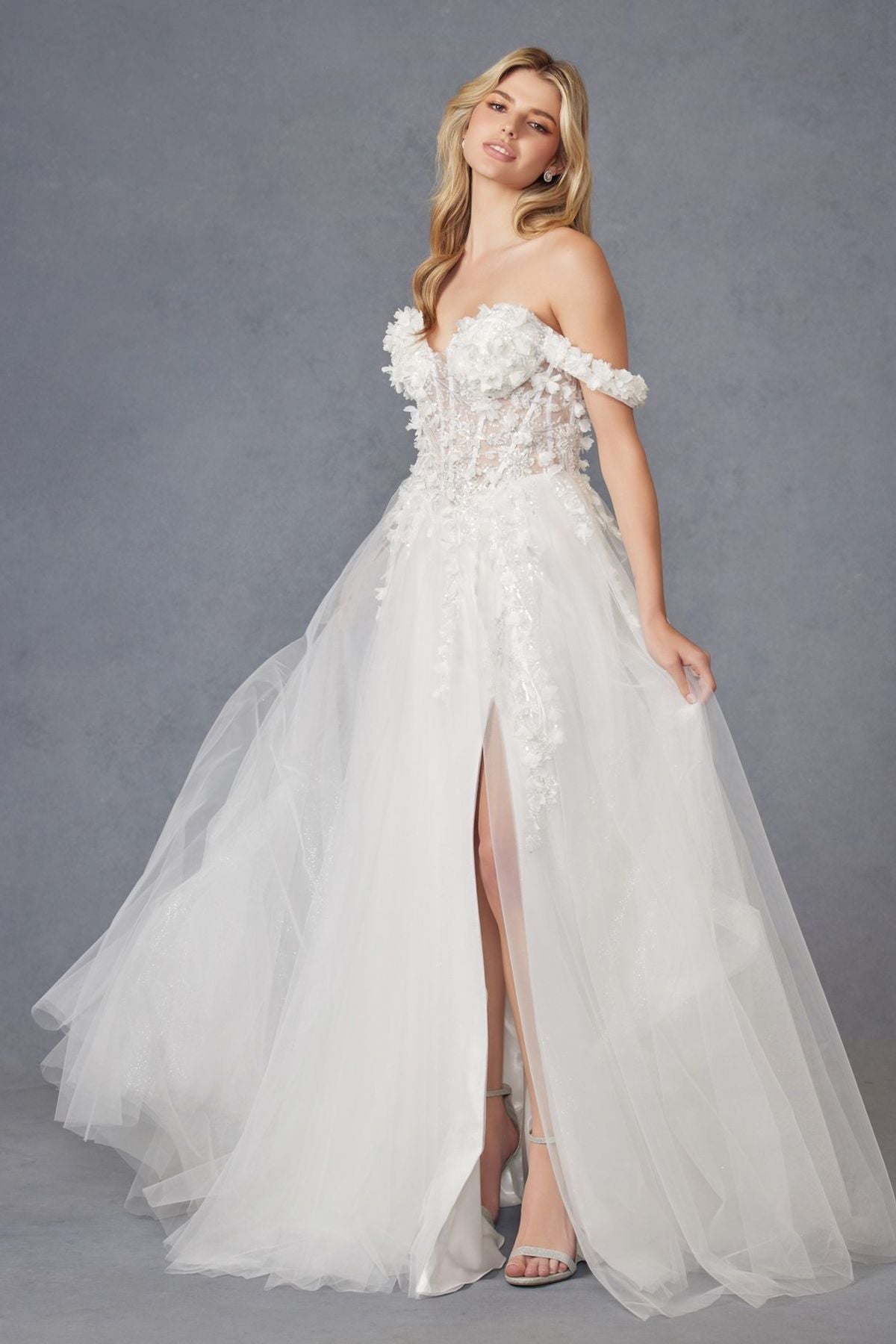 Off-shoulder off-white ball gown with 3D floral lace bodice and flowing tulle skirt, slit