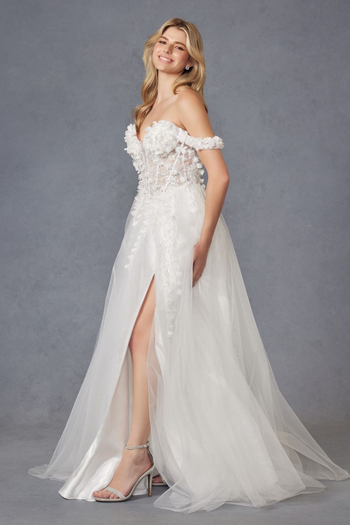 Off-shoulder off-white ball gown with 3D floral lace bodice and layered tulle skirt, front slit