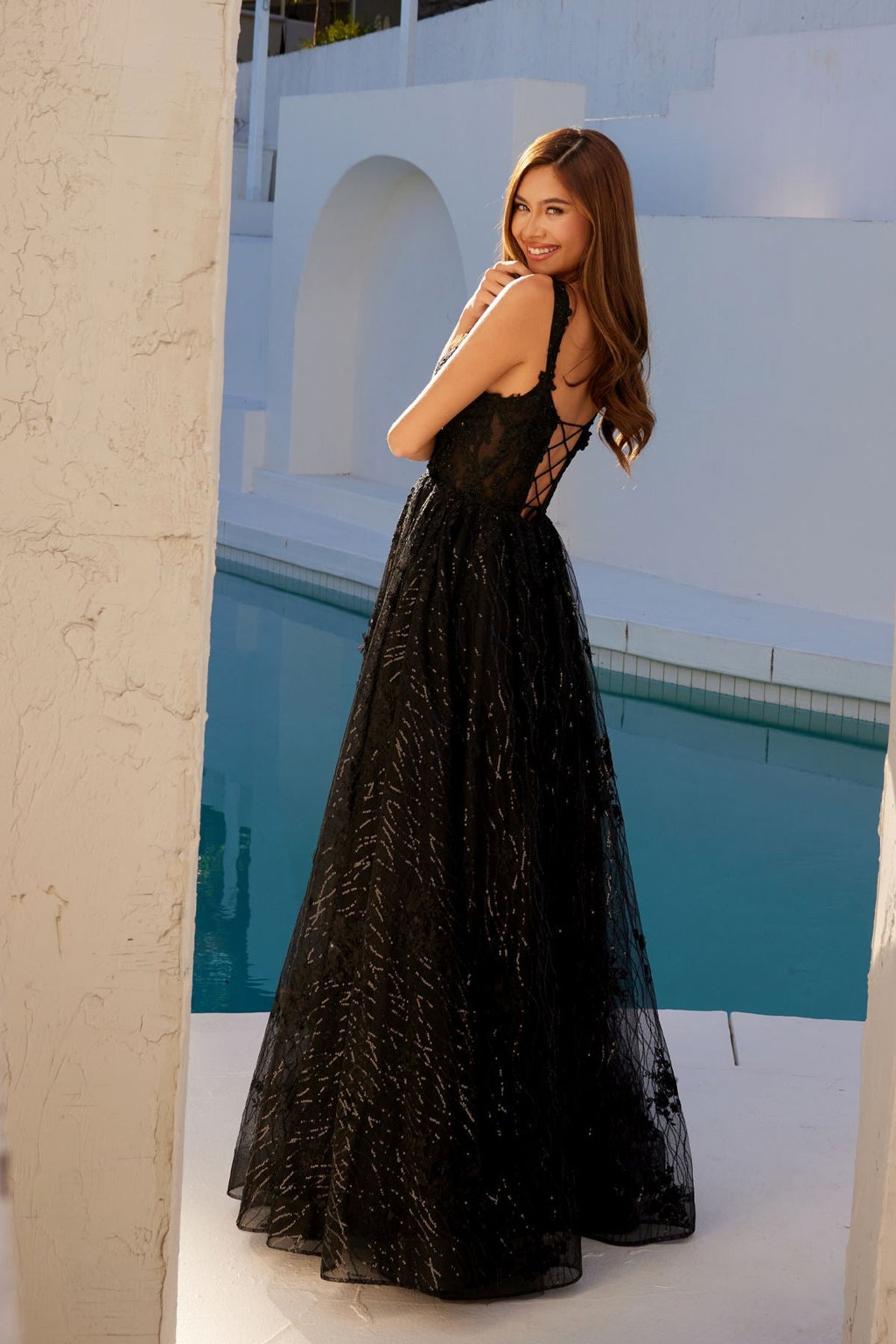 Black A-line evening gown with sleeveless lace bodice and full flared skirt