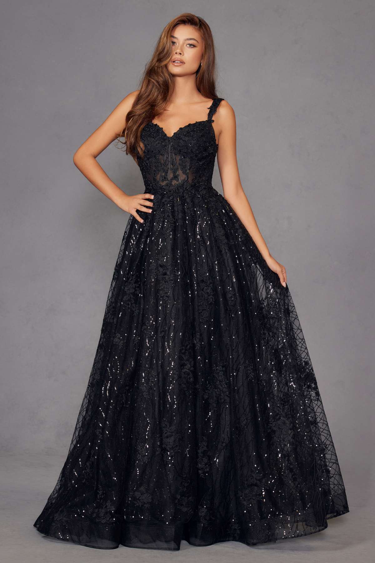 Black A-line evening gown with square neckline, glittery tulle skirt, and straps