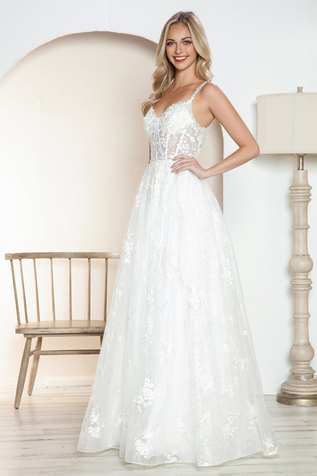 Off-white long A-line lace bridal gown with lace-up style bodice and layered skirt