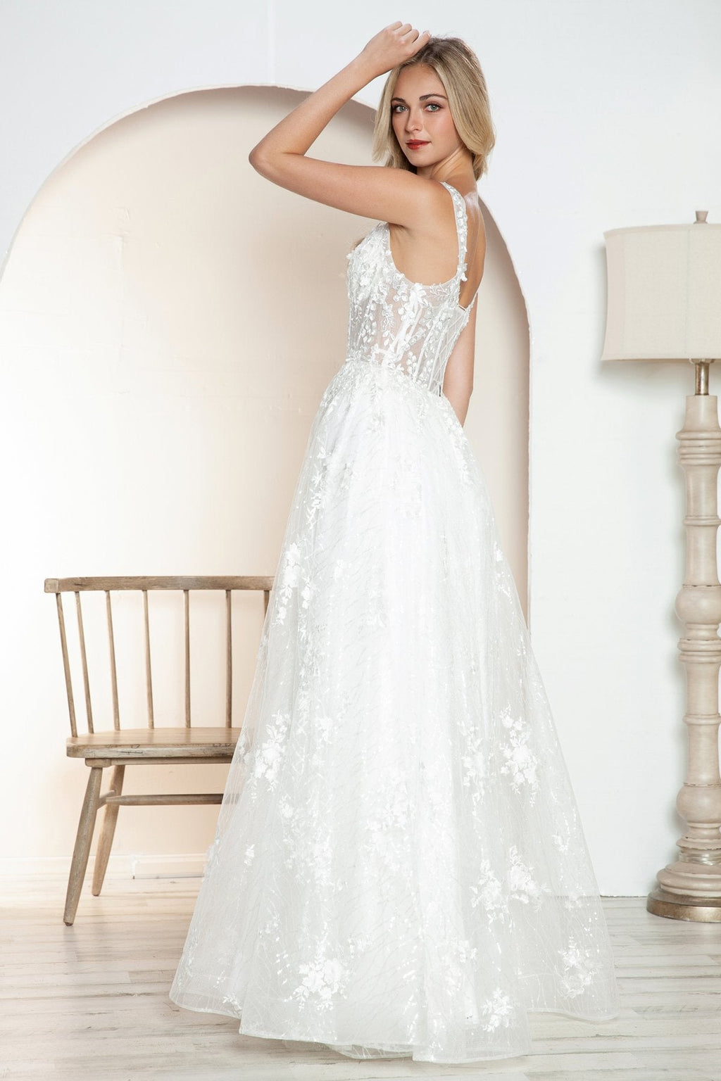 Off-white long A-line bridal gown with floral lace straps and full tulle skirt