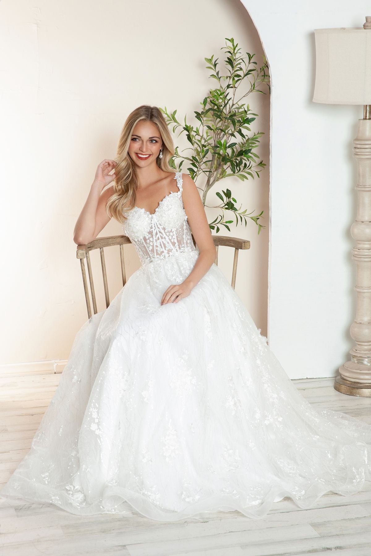 Off-white floral lace A-line bridal gown with lace bodice and tulle skirt