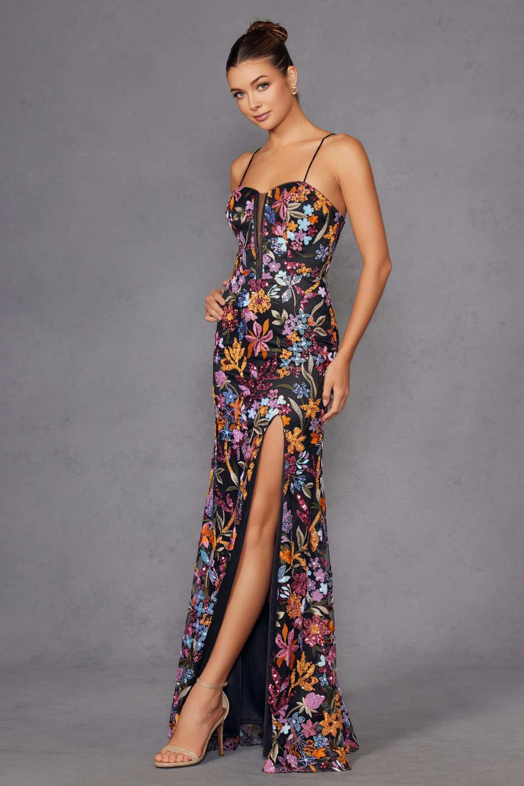 Black floral embroidered evening gown three-quarter view with side slit and thin straps