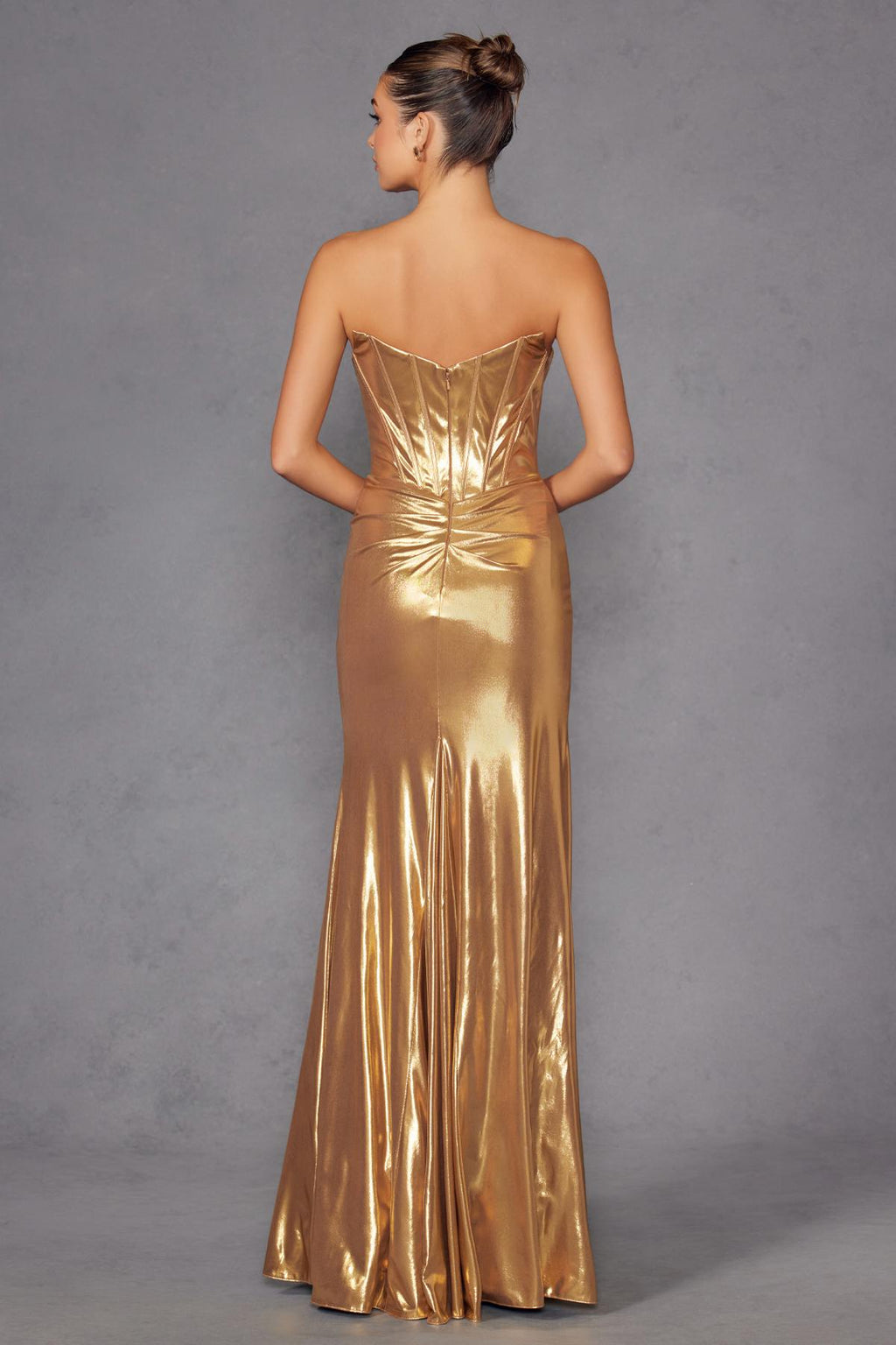 Metallic gold fitted formal gown with corset seams and open back