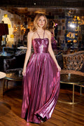 Metallic halter A-line gown in berry with pleated skirt and strap detailing