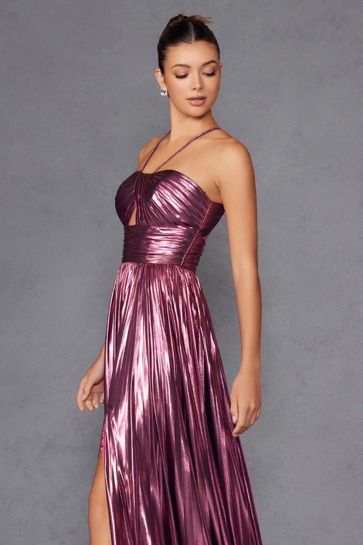 Metallic halter A-line gown in berry with thin halter straps and pleated bodice