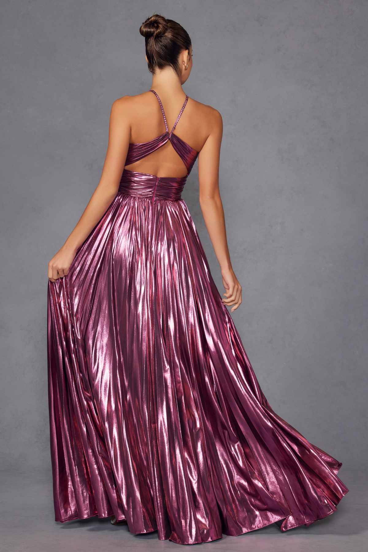 Metallic halter A-line gown in berry from back view with crisscross halter straps