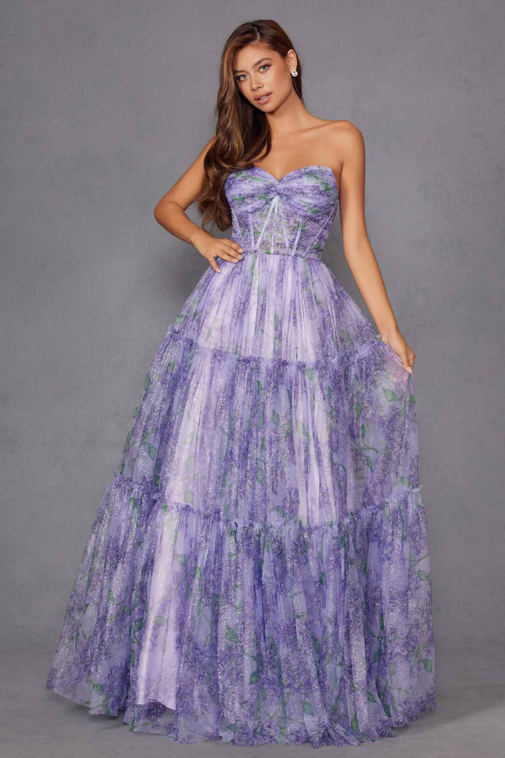 Lilac strapless sweetheart tiered gown with watercolor floral print, standing full length.