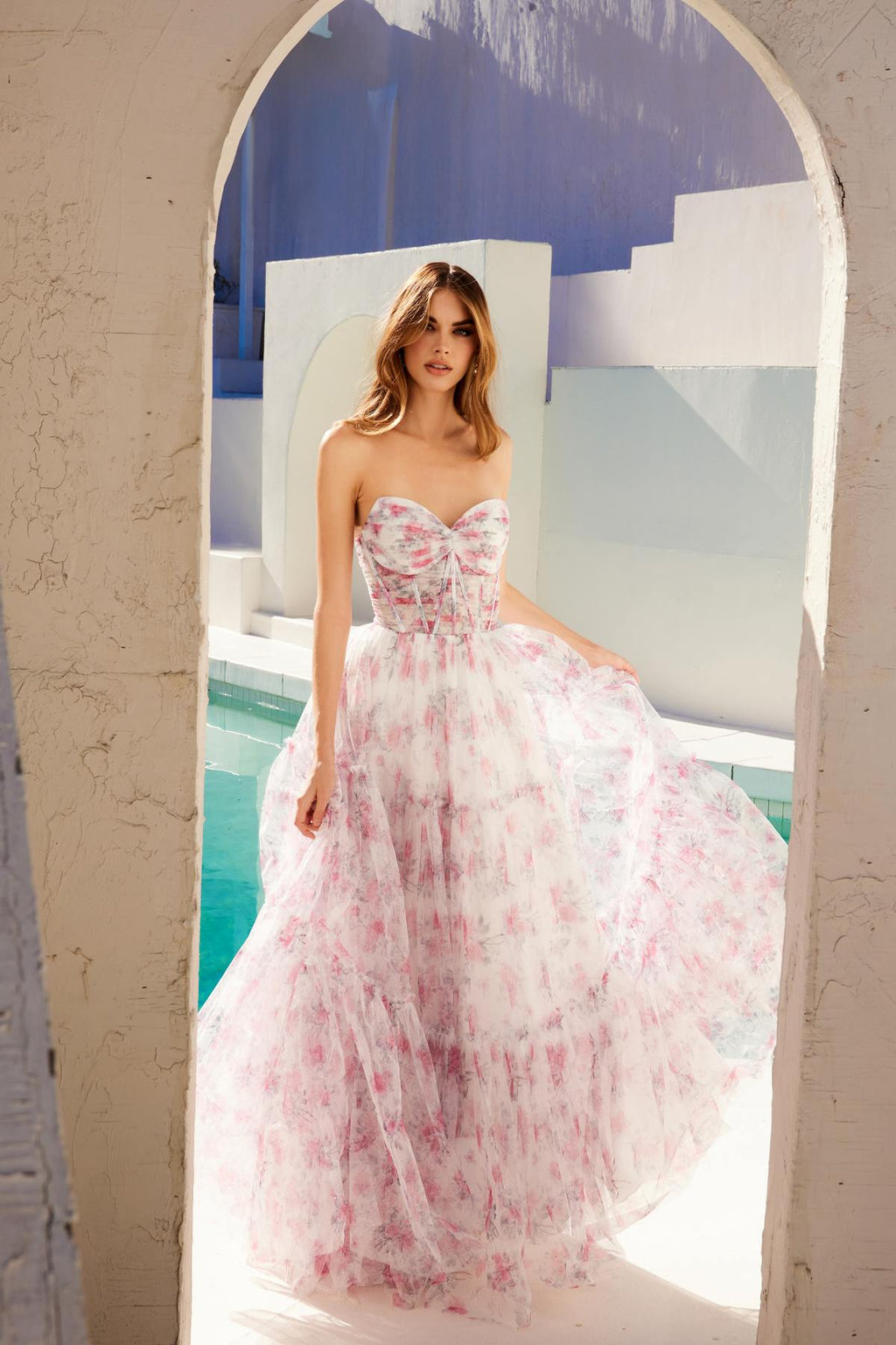 Pink and white strapless sweetheart tiered gown with watercolor floral print, front view.