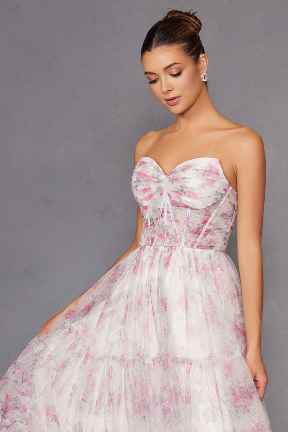 Strapless sweetheart corset gown with pink floral print and tiered, gathered skirt