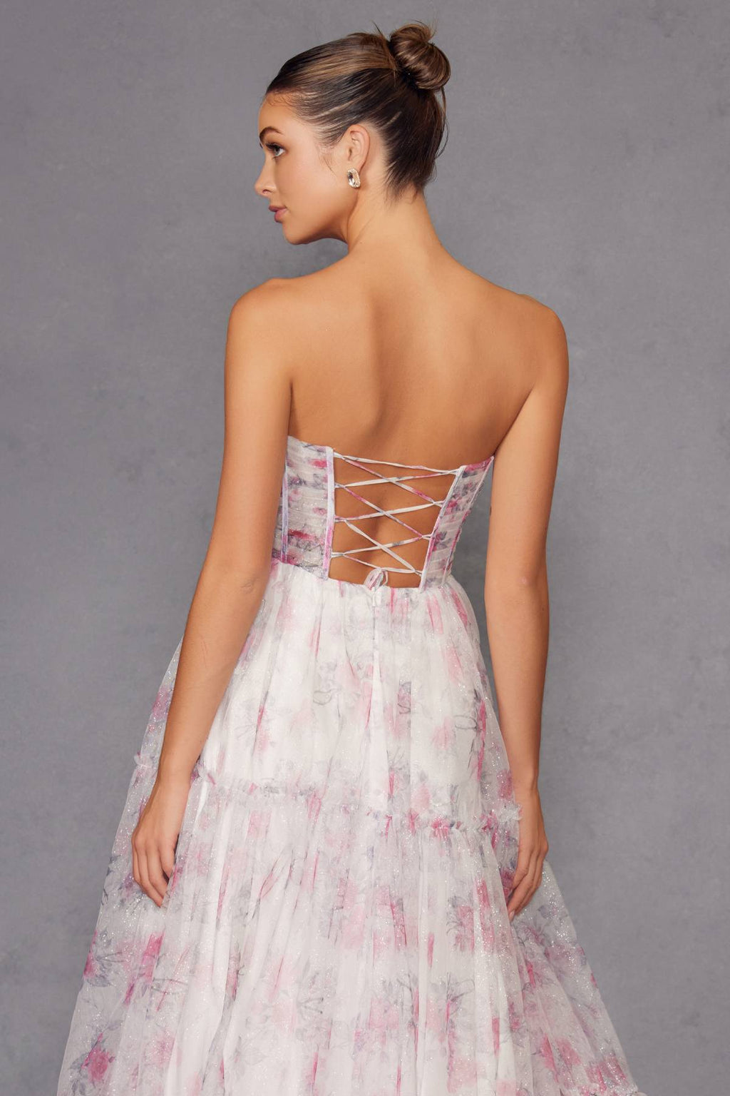 Strapless sweetheart gown back with crisscross lace-up straps and tiered floral skirt