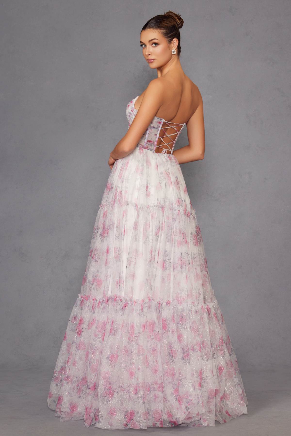 Strapless sweetheart gown back detail with crisscross straps and tiered pink floral skirt