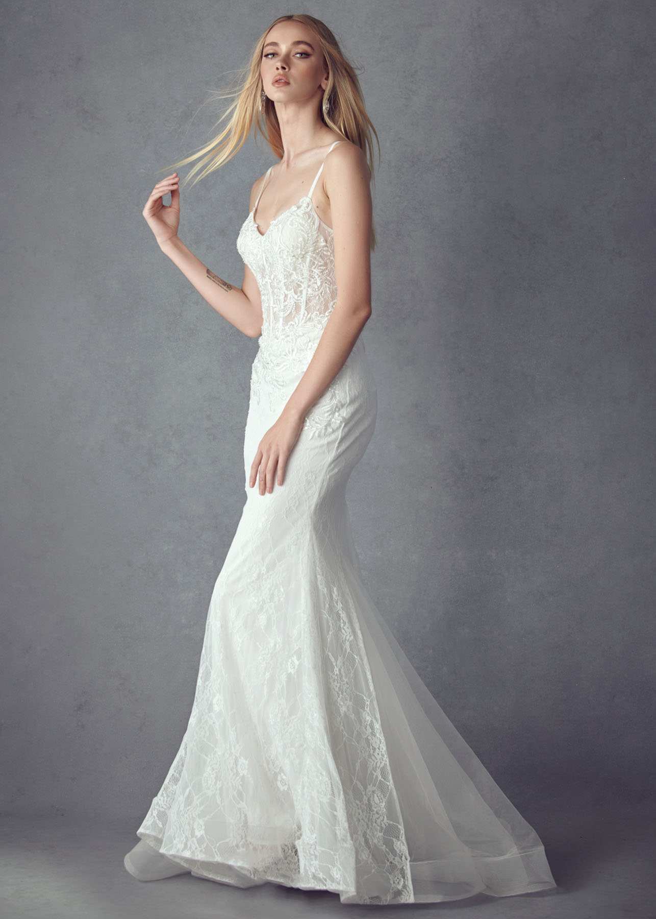 Off-white embellished lace mermaid dress with thin straps and flared lace hem