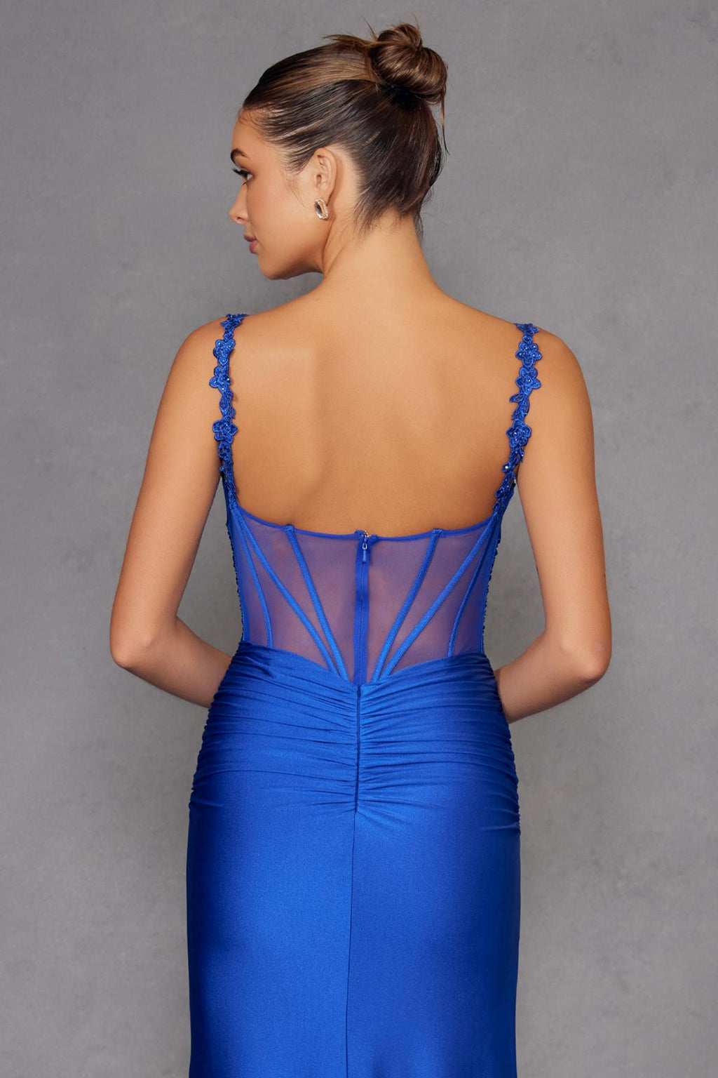 Royal blue backless fitted evening gown with sheer corset panel and straps
