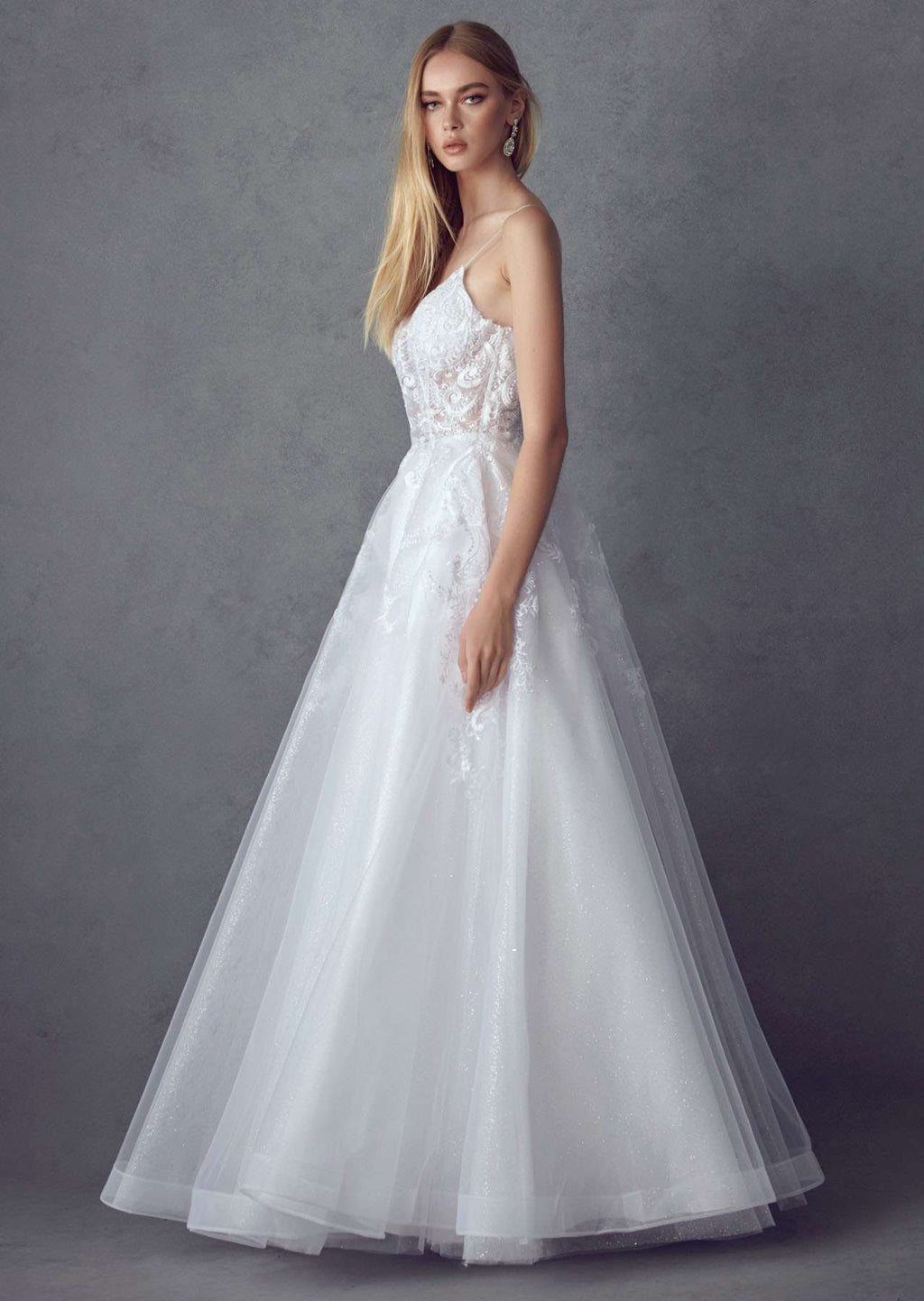 White lace A-line tulle wedding ball gown with thin straps, embellished bodice, full skirt