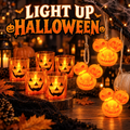 Halloween jack-o'-lantern string lights with glowing pumpkin bulbs and candle holders