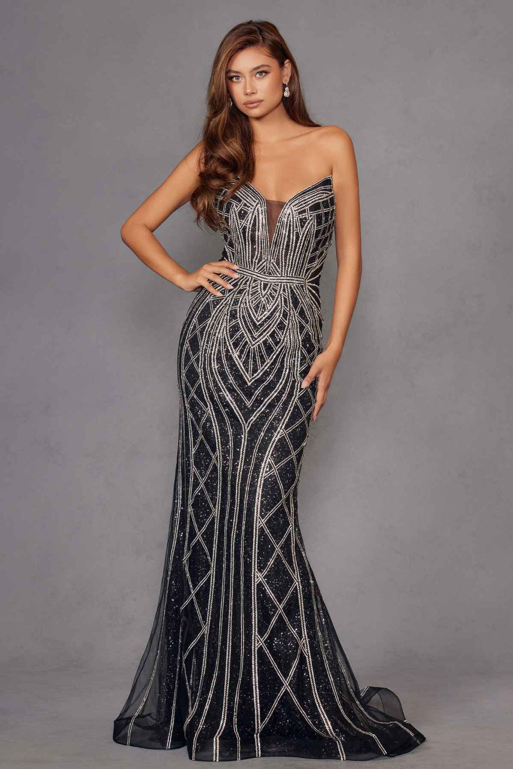 Strapless fitted evening gown with silver geometric beadwork on dark mesh, flared long skirt.