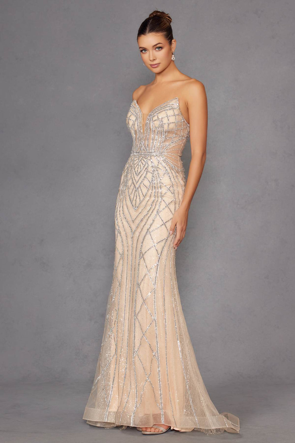 Champagne strapless mermaid-style evening gown with beaded lattice pattern and fitted skirt