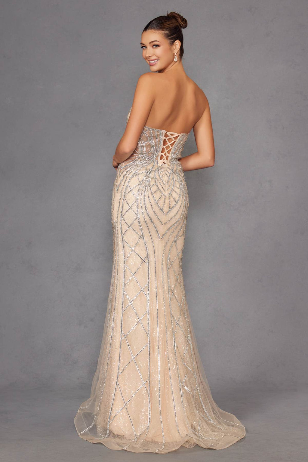 Champagne strapless evening gown with low open-back and beaded geometric pattern