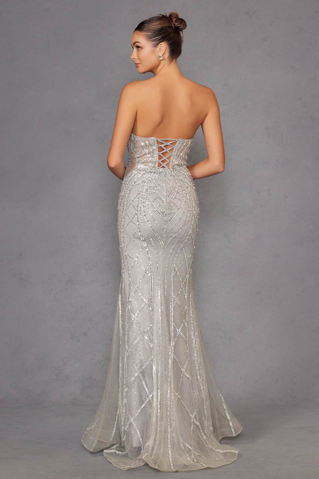 Silver strapless fitted evening gown back view with crisscross open back panel