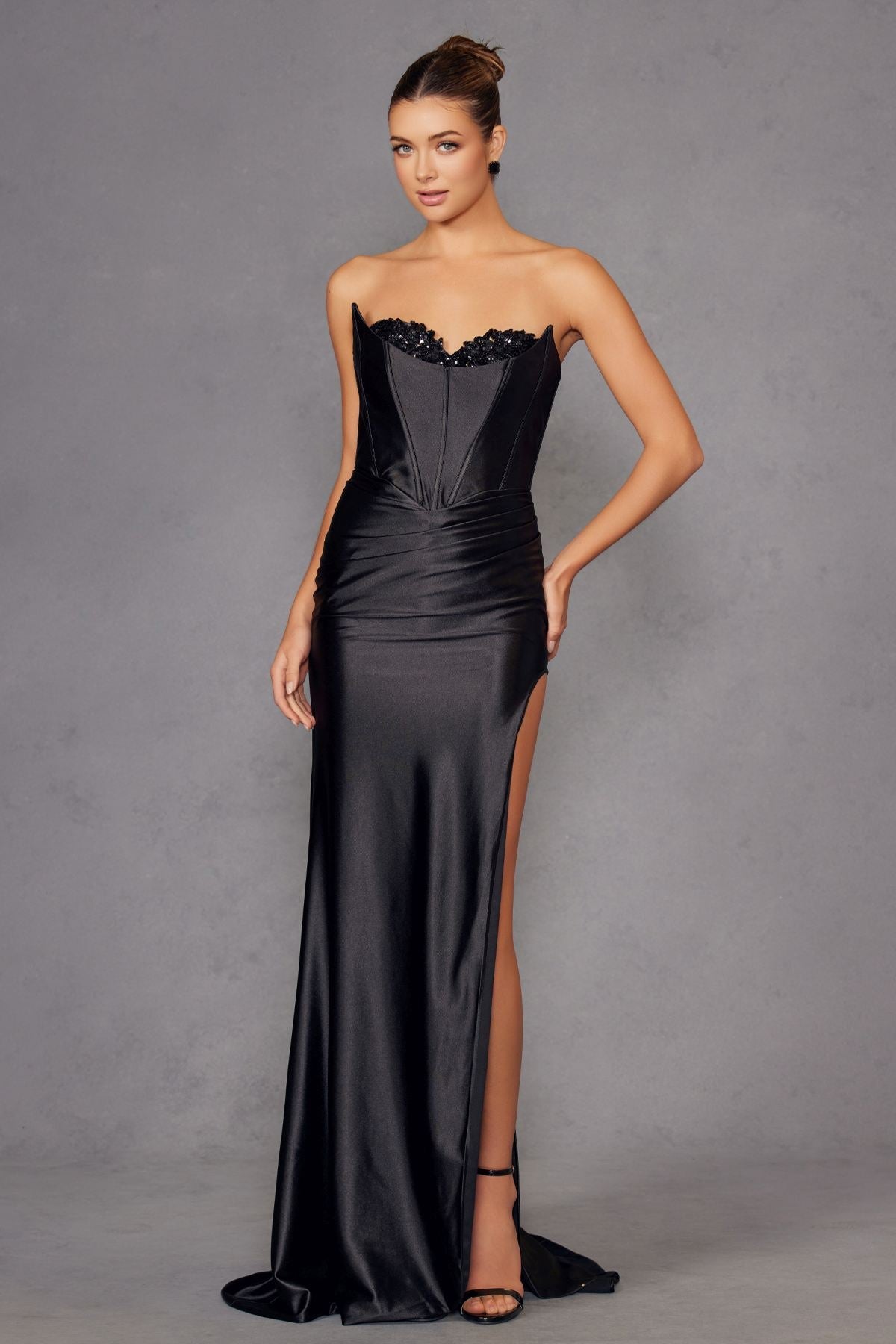 Black satin strapless sweetheart gown with beaded trim and high side slit