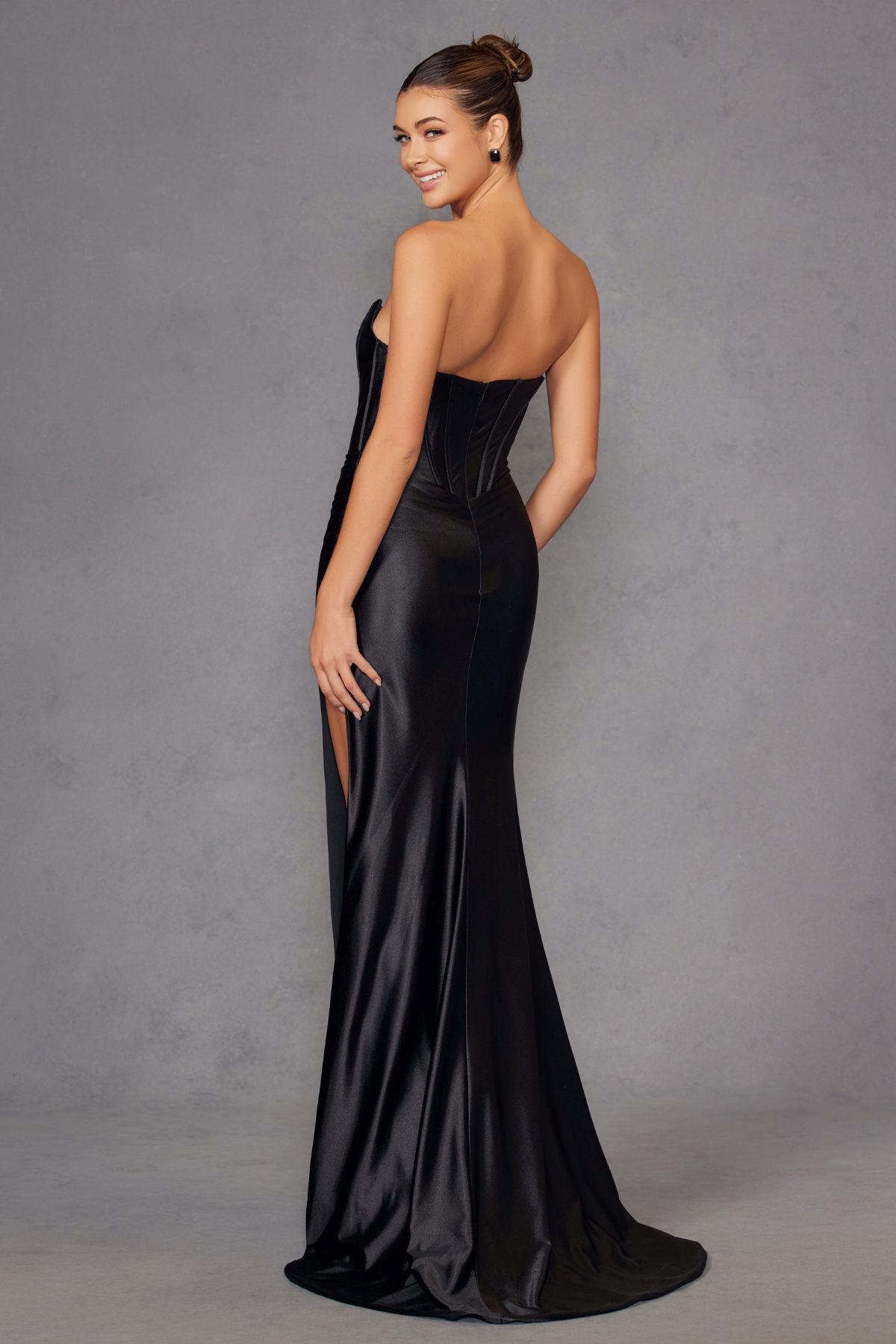 Black satin strapless gown with corset back, long fitted skirt and side slit