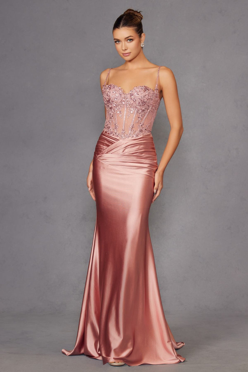 Rose gold satin sweetheart prom gown with jeweled bodice and long fitted skirt