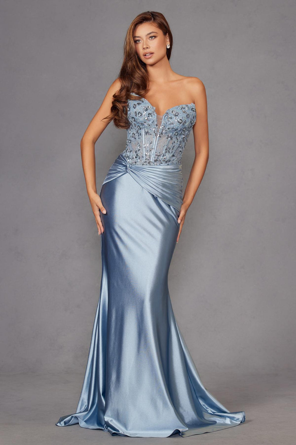 Light blue strapless sweetheart corset prom gown with beaded bodice and draped skirt