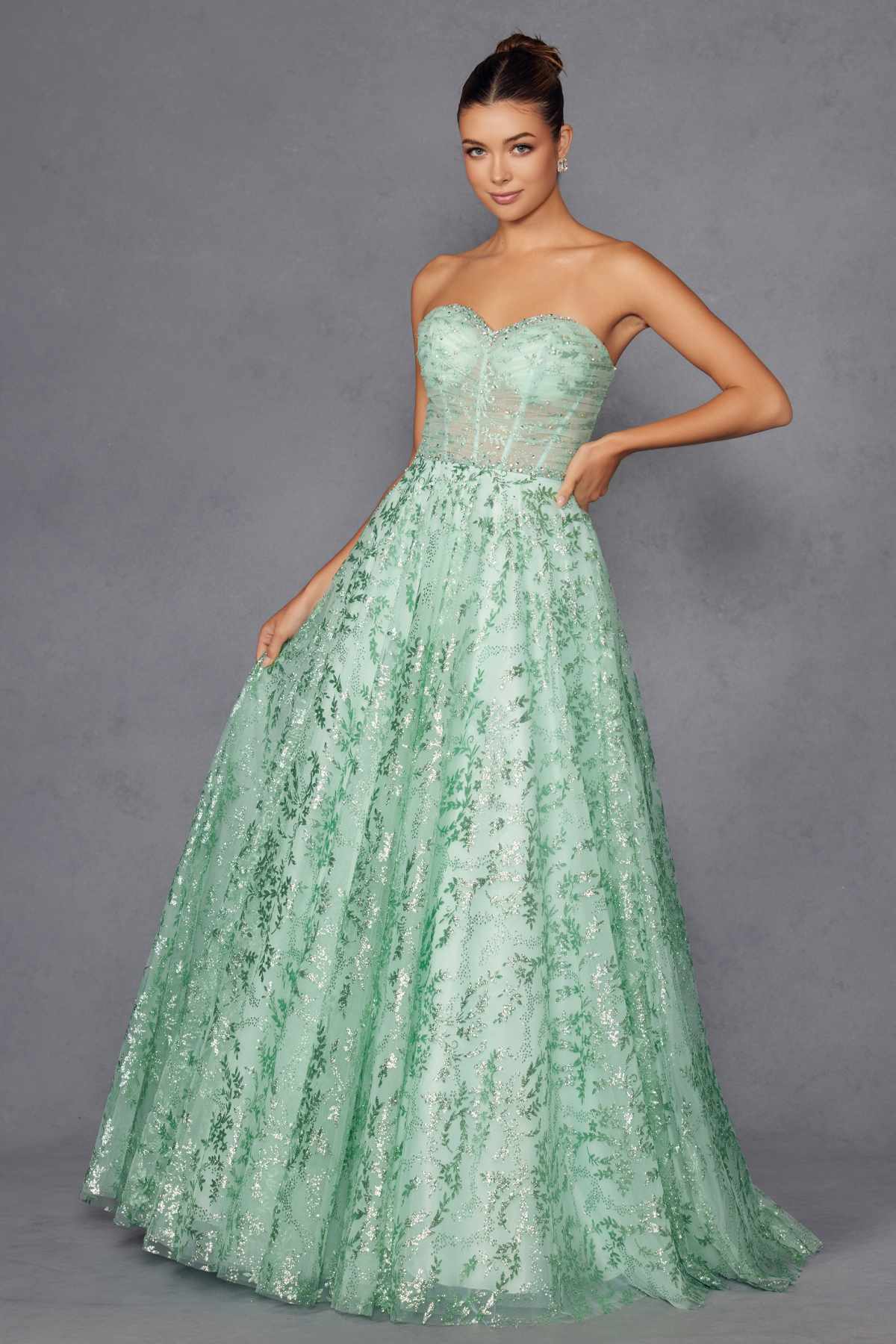 Mint green strapless sweetheart A-line evening gown with lace pattern and volume