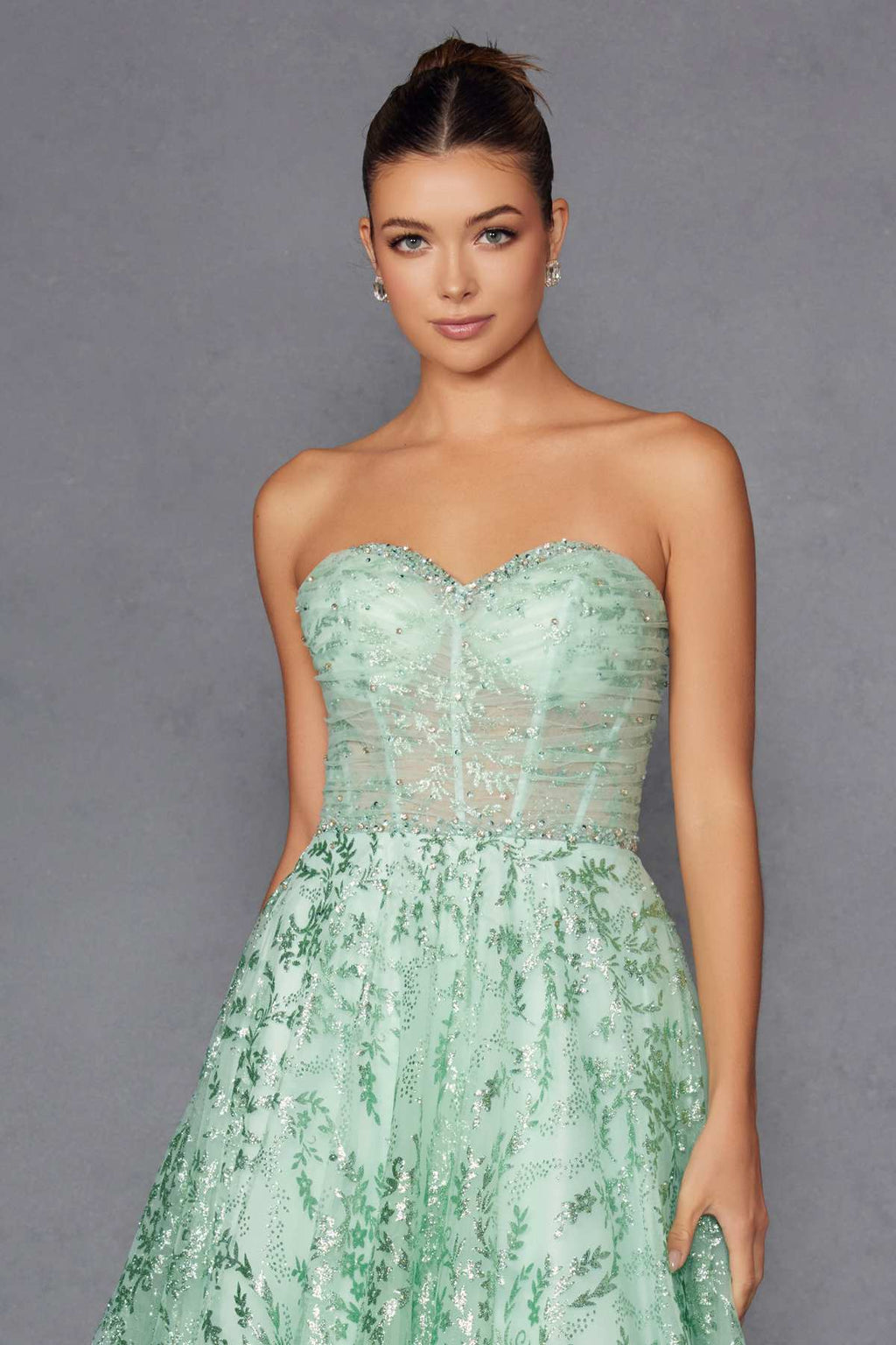 Mint green sweetheart strapless lace bodice gown with pleated waist skirt