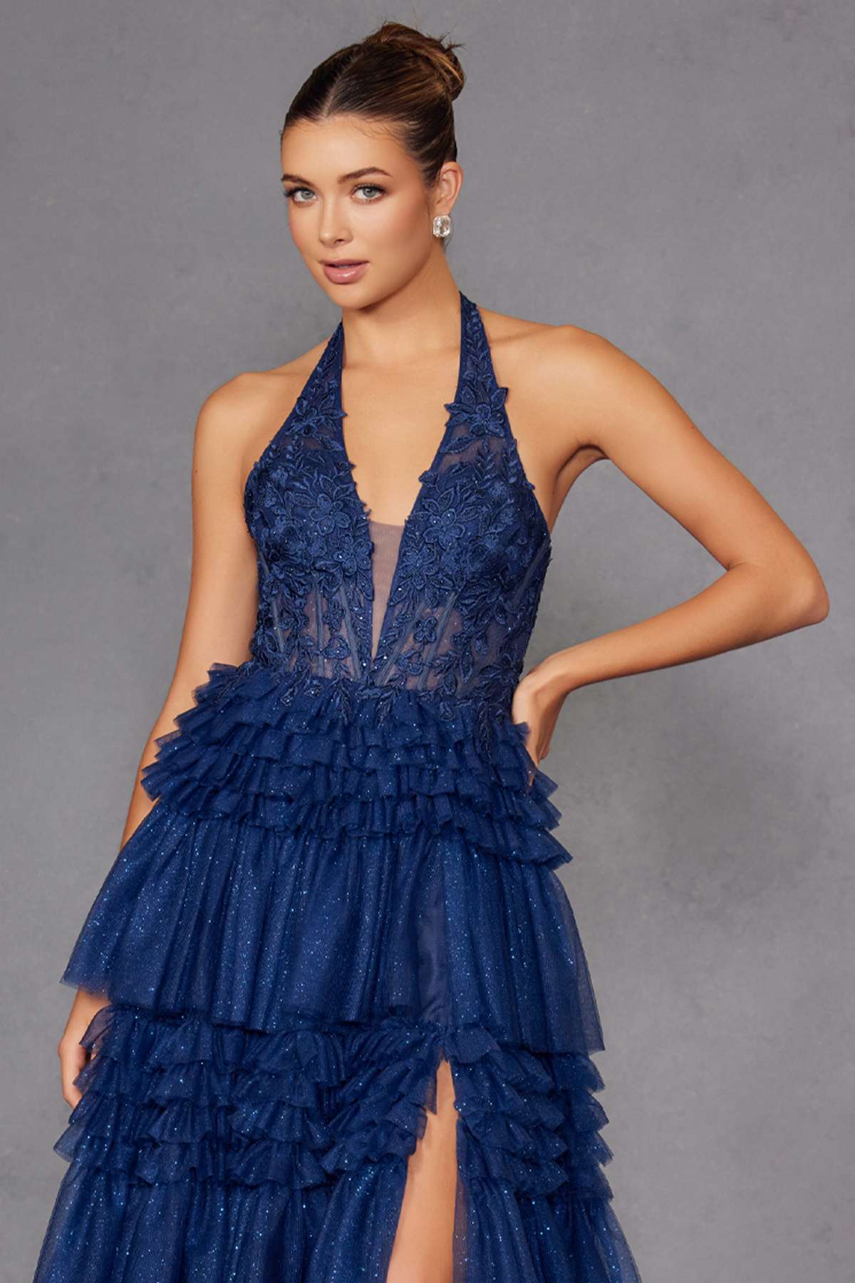 Navy blue halter V-neck layered tulle A-line gown, close-up of tiered skirt