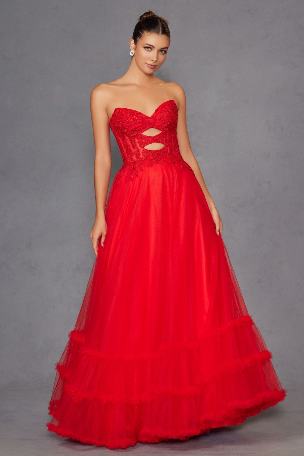 Red strapless sweetheart A-line tulle gown with lace bodice and waist keyhole cutout