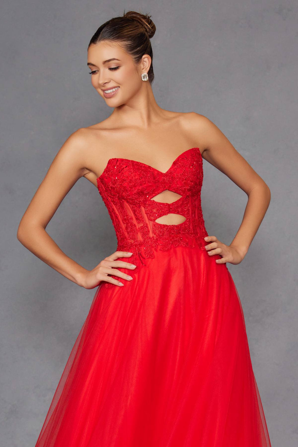 Red strapless sweetheart gown with lace bodice, keyhole cutout, and flowing A-line skirt