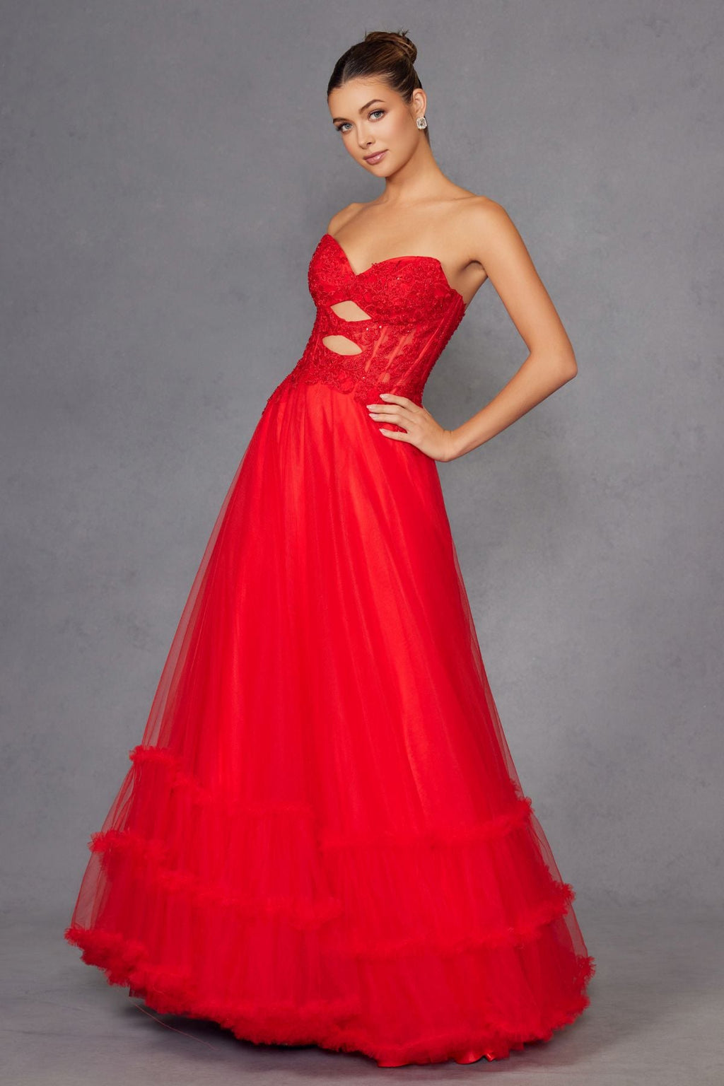 Red strapless sweetheart A-line gown with keyhole cutout and tiered tulle skirt