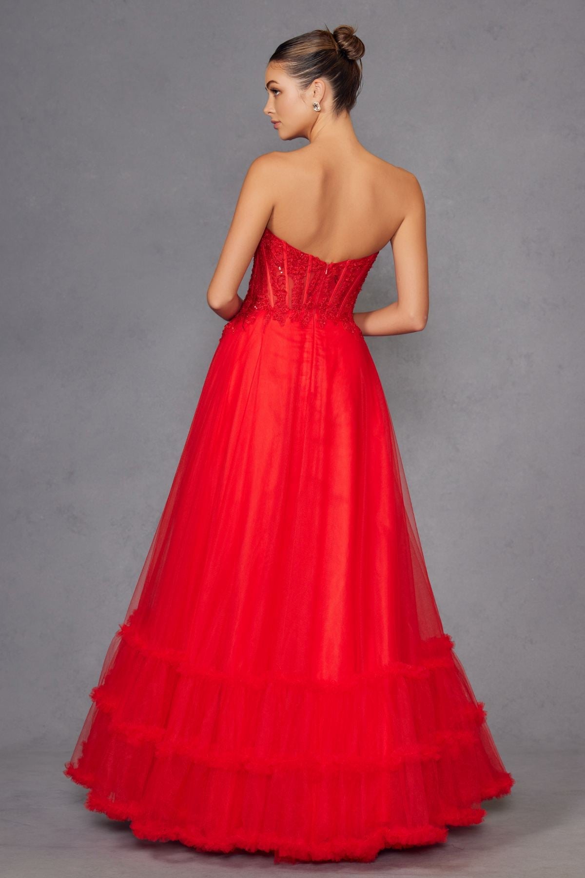 Red strapless A-line tulle gown with tiered skirt and fitted lace bodice