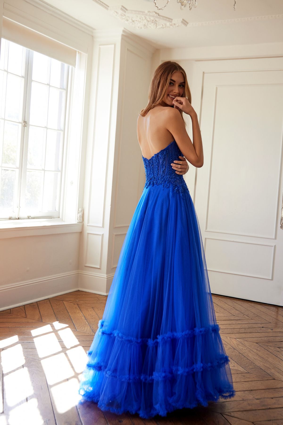 Blue strapless sweetheart A-line tulle gown with keyhole cutout bodice