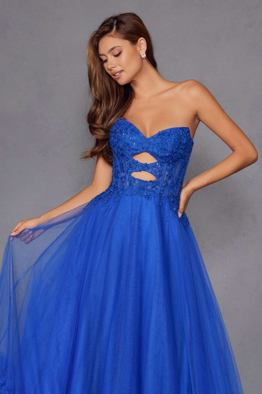 Blue strapless sweetheart gown with lace bodice and keyhole cutout detail