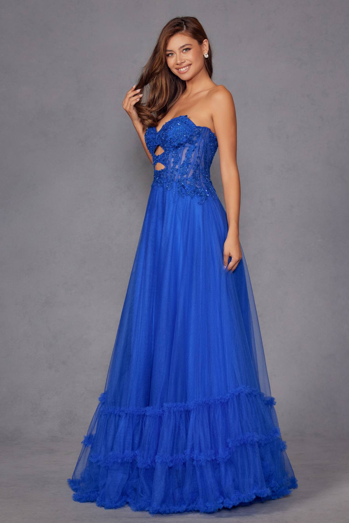Royal blue strapless sweetheart gown with fitted bodice and tiered tulle A-line skirt