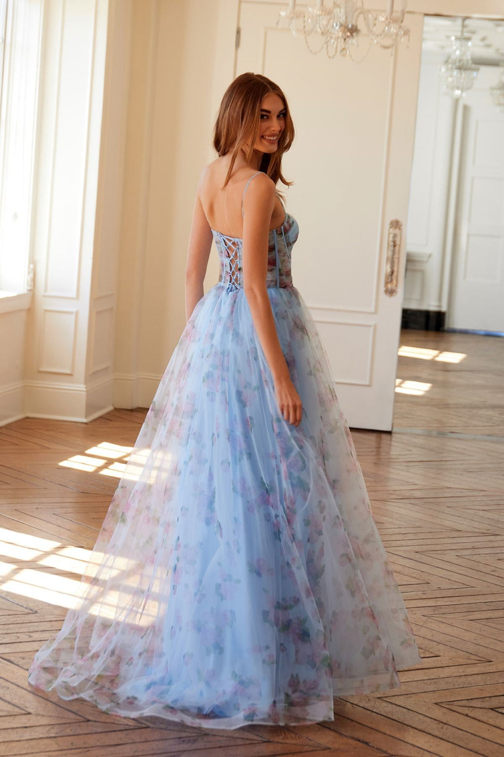 Light blue floral tulle A-line gown with spaghetti straps and front slit
