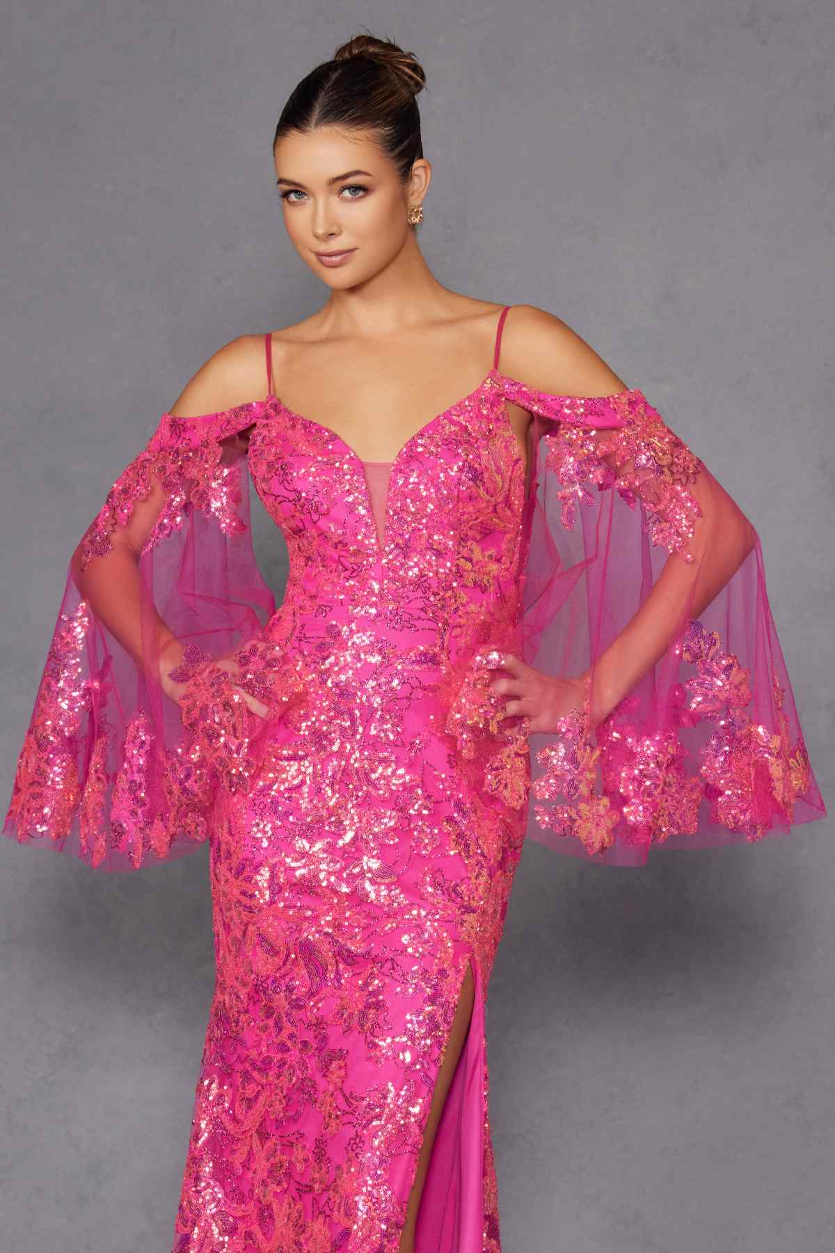 Fuchsia sequin fitted gown with sweetheart neckline and sheer cape sleeves