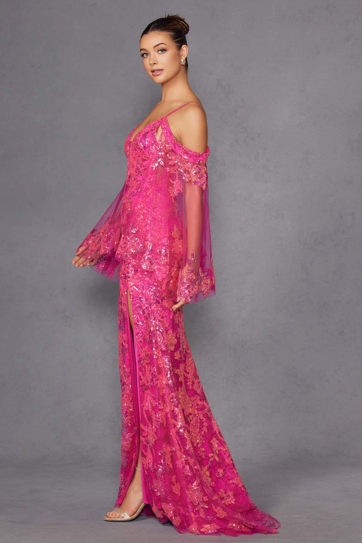 Fuchsia sequin fitted cold-shoulder gown with sheer long sleeves and side slit