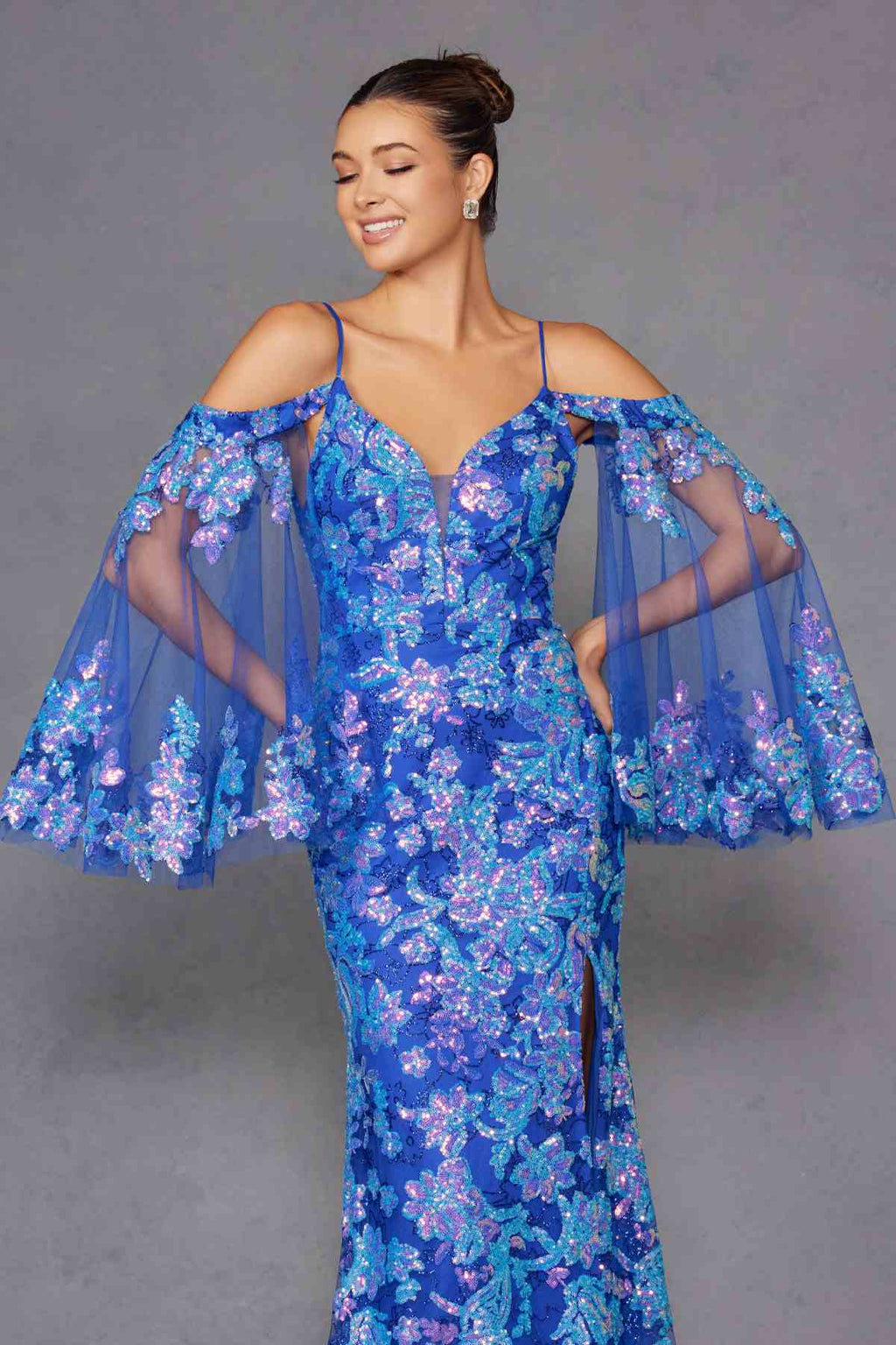 Blue sequin fitted gown with V neckline and sheer cold-shoulder bell sleeves, slit