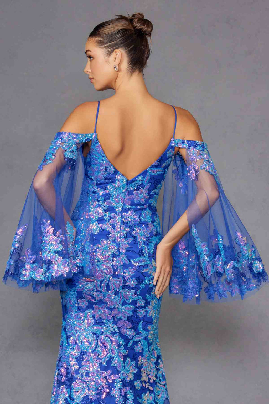 Blue sequin fitted gown with V neckline, cold-shoulder flutter sleeves, open back