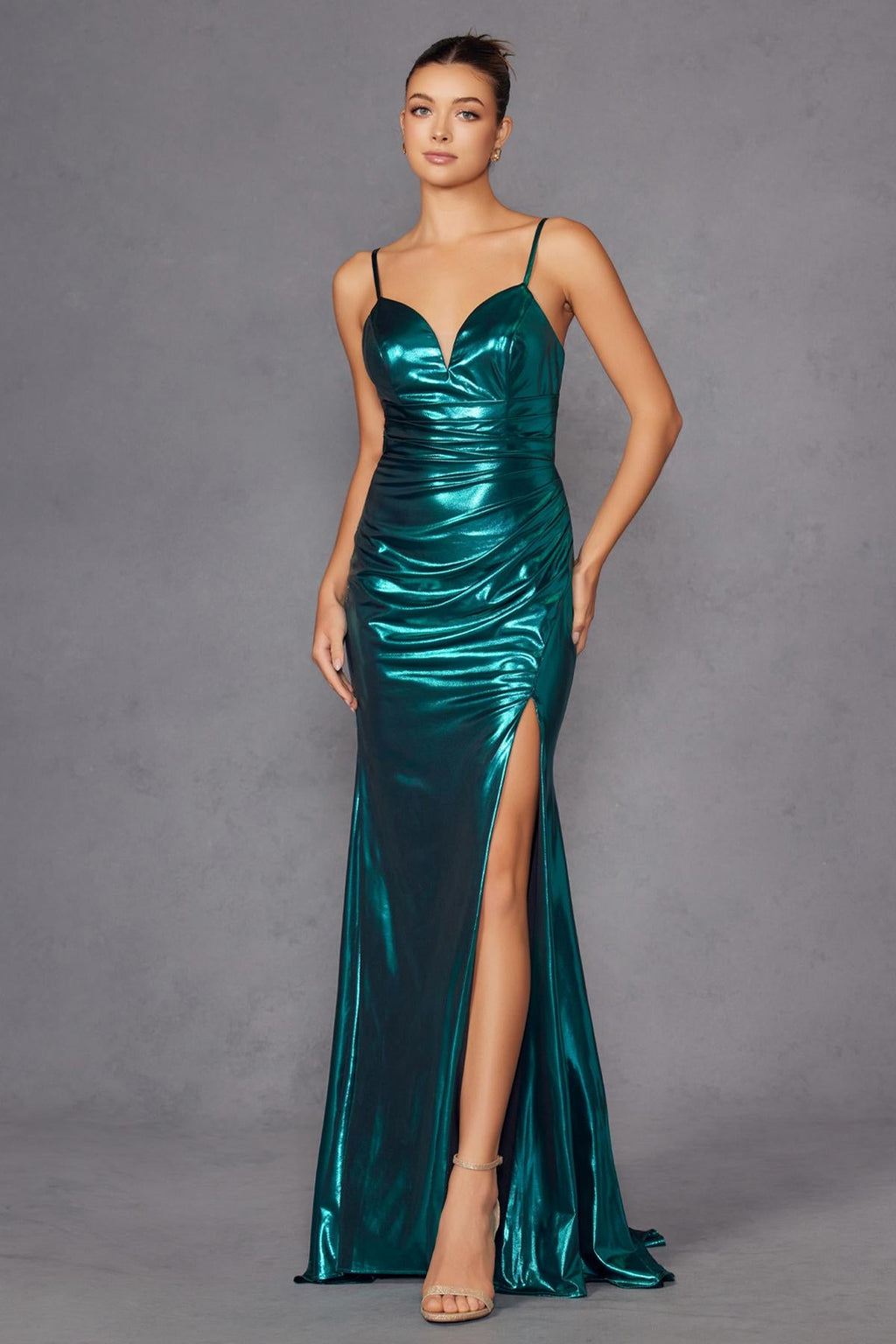 Teal metallic fitted evening gown with spaghetti straps, sweetheart bodice, and front slit.
