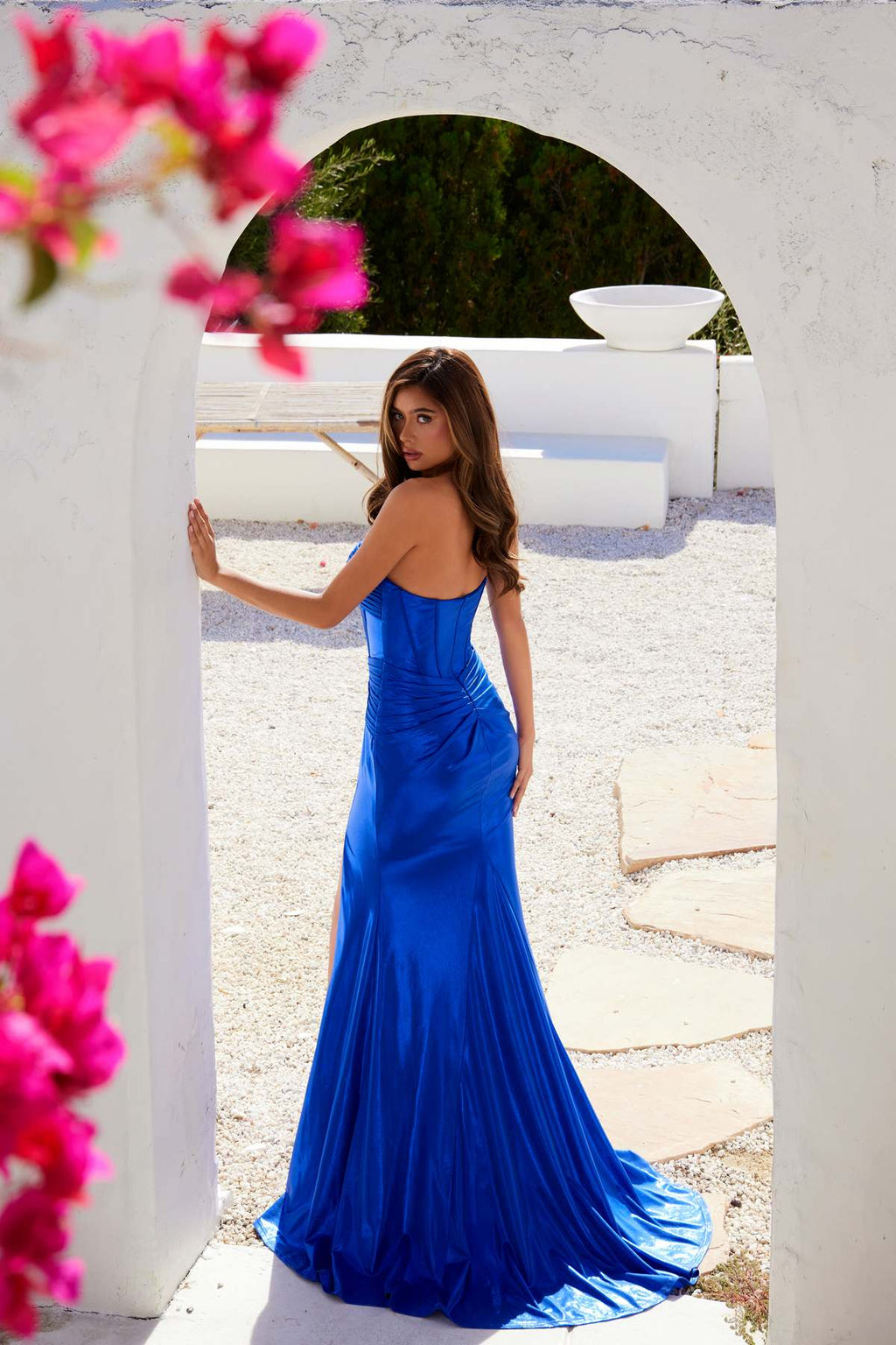 Blue strapless sweetheart prom gown, fitted silhouette with long train and side slit.