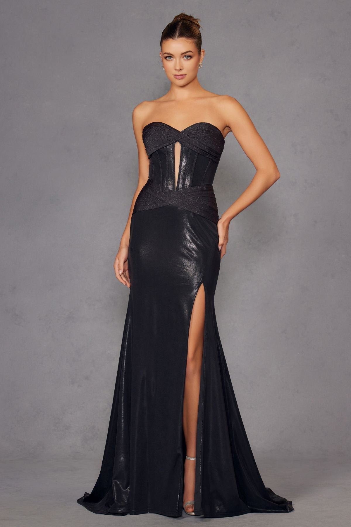 Black strapless sweetheart fitted metallic prom gown with corset bodice and side slit.