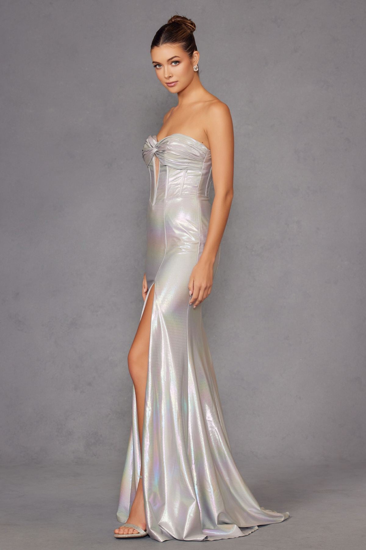 Iridescent strapless sweetheart prom gown in silver satin with side slit and draped skirt